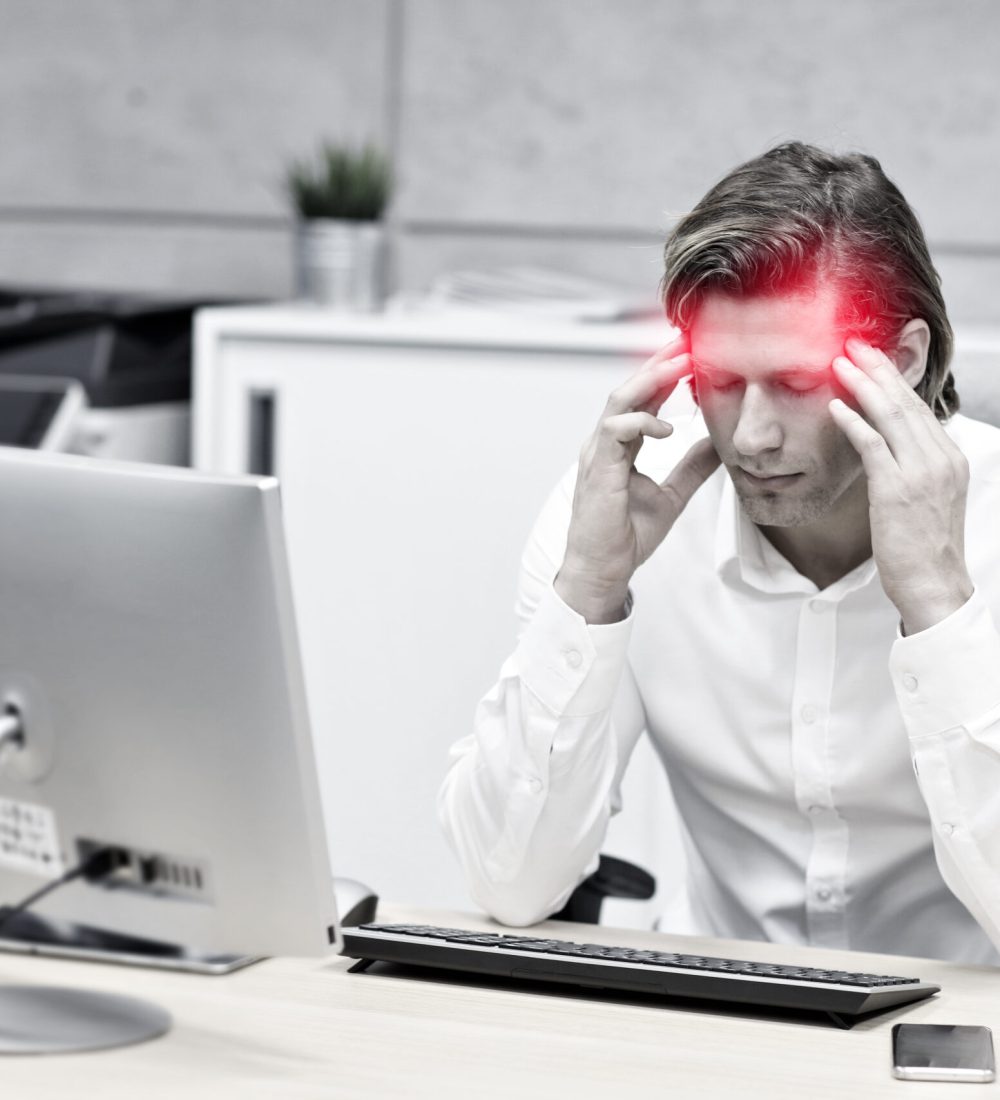 Close up portrait of businessman with headache t workplace Portrait of businessman at workplace